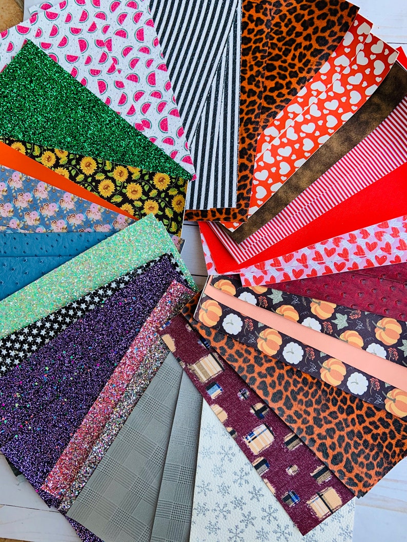 May include: Assortment of colorful patterned fabric sheets, including green glitter, red and white watermelon print, black and white stripes, brown leopard print, and a variety of other designs.