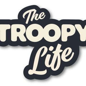 May include: Black and white graphic design with the text "The TROOPY Life" in a vintage style font.