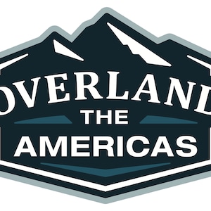 May include: A blue and white logo with a mountain range graphic and the text "Overland The Americas".