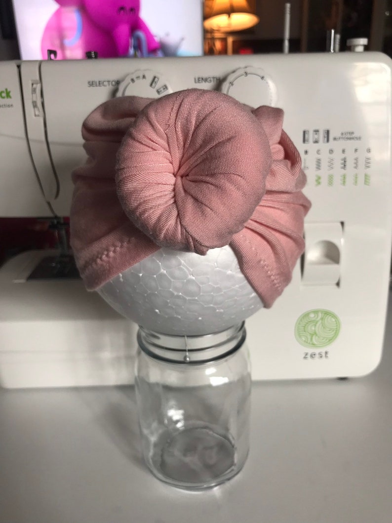 Pink baby turban with bun