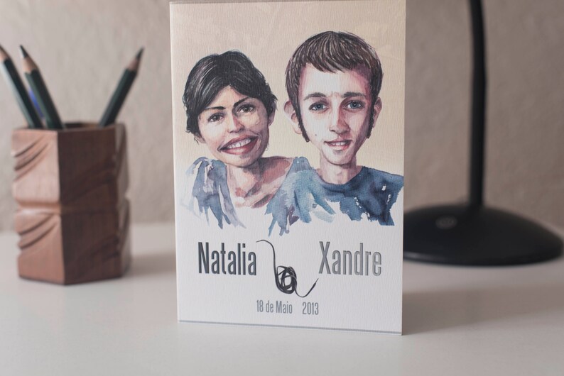 Op de afbeelding: Een aquarel-illustratie van een stel, Natalia en Xandre, met de datum 18 de Maio 2013.