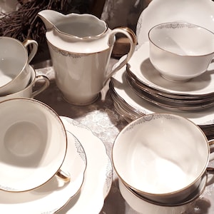 Vintage coffee service - cups - saucers - cake plates - milk jugs