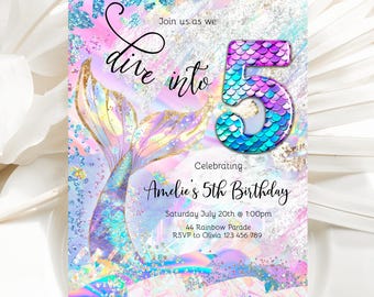 May include: A mermaid tail with iridescent scales and a large number 5 with matching scales. The invitation reads "Join us as we dive into 5. Celebrating Amelie's 5th Birthday. Saturday July 20th @ 1:00pm. 44 Rainbow Parade. RSVP to Olivia 123 456 789".
