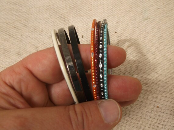 Multi-coloured bangles, random metal bracelets, d… - image 1