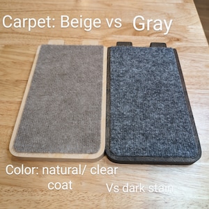 May include: Two samples of carpet, one beige and one gray, are shown on wooden boards. The beige carpet is on a board with a natural finish, while the gray carpet is on a board with a dark stain. The text "Carpet: Beige vs Gray" is at the top of the image, and the text "Color: natural/clear coat vs dark stain" is at the bottom.