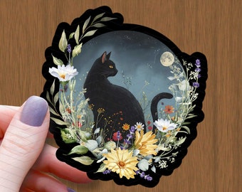 May include: A black cat sits in a field of flowers, looking to the right. The flowers are in shades of yellow, white, and purple. The background is a dark blue sky with a crescent moon.