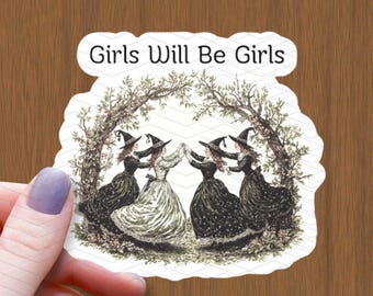 May include: A sticker featuring a vintage illustration of four women in witch costumes dancing in a circle under a tree. The text "Girls Will Be Girls" is printed above the illustration.