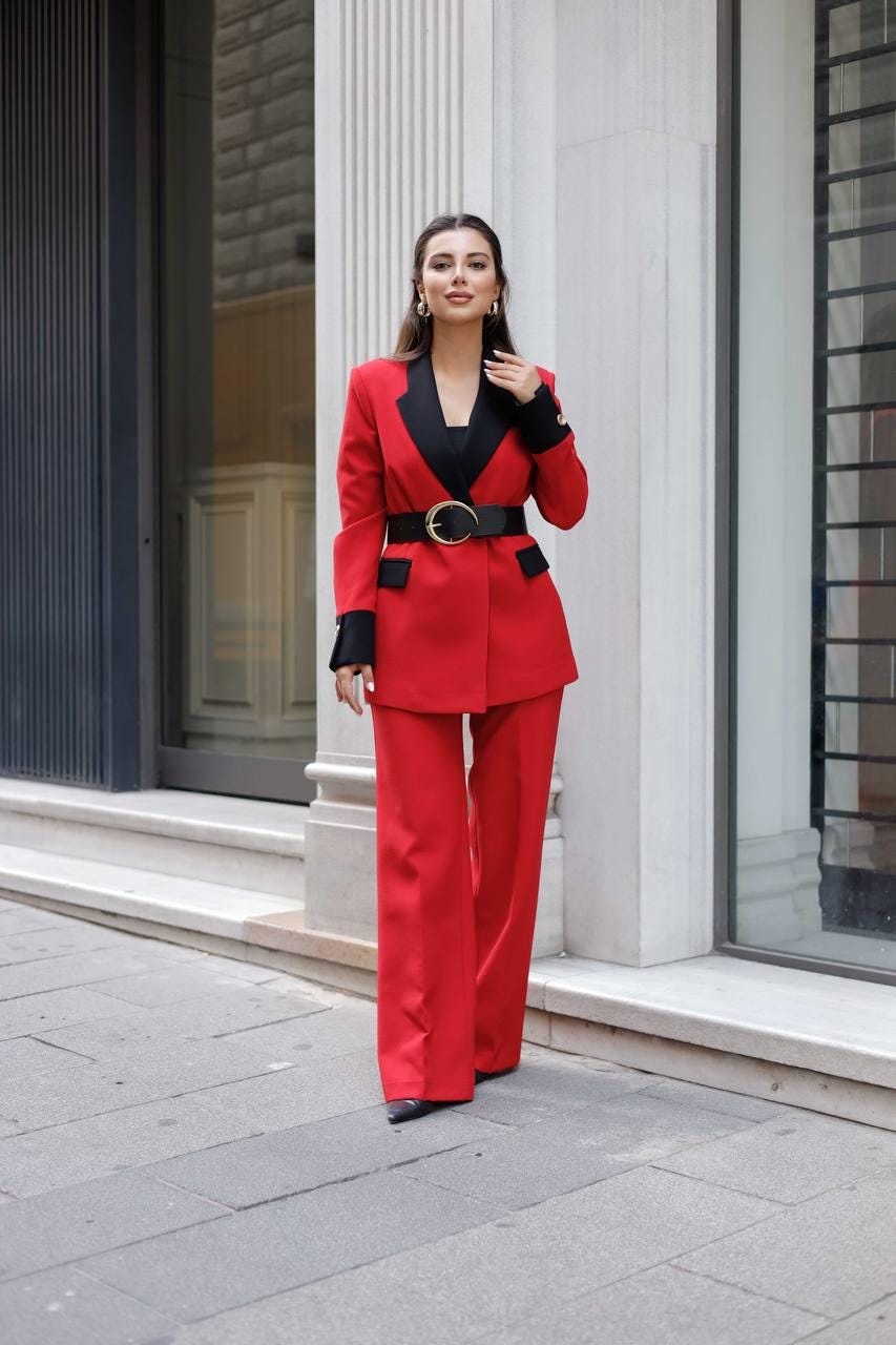 red dress and suit Woman in beautiful red dress and man wearing blue classical suit with bow tie