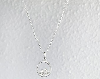 necklace, 925 sterling silver chain with 12mm wave medallion.