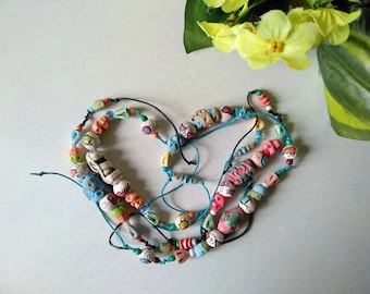 Ceramic bracelet with multi-colored handmade clay beads and seed beads. Jewelry from ceramics. Colorful collection.