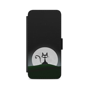 May include: A black phone case featuring a black cat sitting on a green hill in front of a full moon.