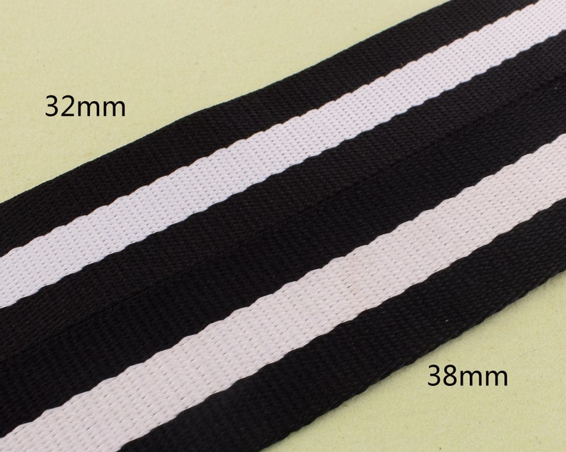 May include: Black and white striped ribbon with a width of 32 mm and 38 mm.