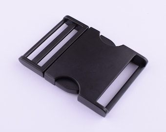 May include: Black plastic side release buckle for a strap or belt.
