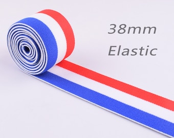 May include: A roll of 38mm wide red, white, and blue striped elastic. The elastic is rolled up and the text "38mm Elastic" is visible.