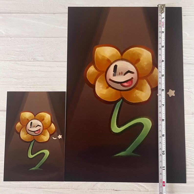 May include: A yellow flower with a smiling face and a tongue sticking out. The flower is on a green stem and is in a spotlight. The background is dark brown.