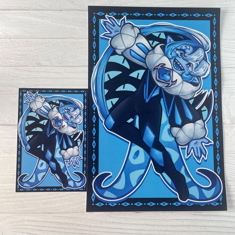May include: Two art prints depicting a cartoon jester character in blue and black attire with white accents. The character has a playful expression. The background is light blue with a dark blue border, and the prints are of different sizes.