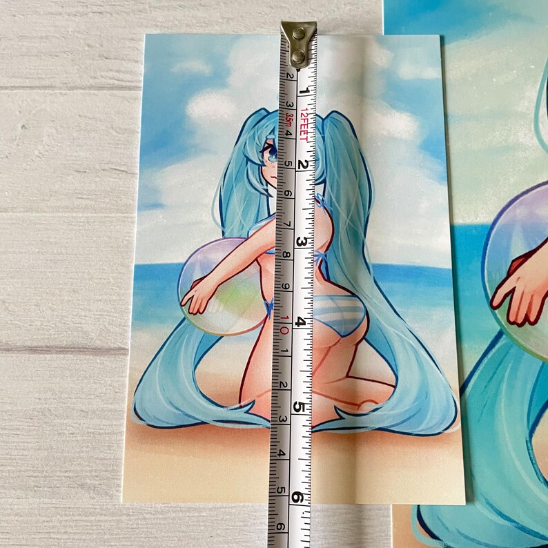 May include: A digital illustration of a blue-haired anime character wearing a bikini and holding a beach ball. The character is standing on a beach with blue water and white clouds in the background.