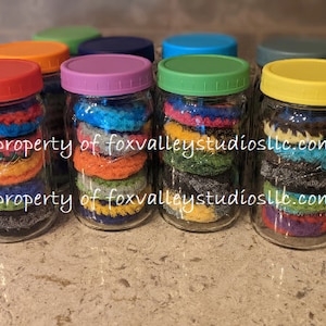 Double thickness scrubbies in a decorative jar with screw top lid