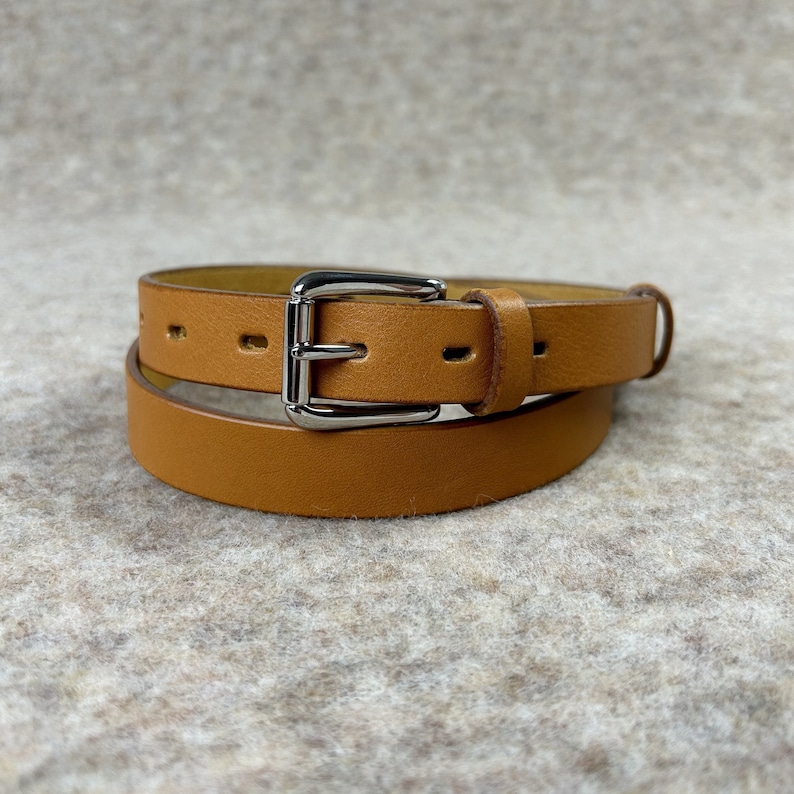 1 inch wide genuine cow leather belt in saffron color.
This handmade leather belt is made from genuine cowhide leather of the highest quality.
Womens leather belt that goes perfectly with jeans and dresses.