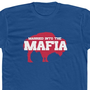 May include: Royal blue t-shirt with the text "MARRIED INTO THE MAFIA" in white and a red buffalo graphic. The shirt is a crew neck style and made of a soft material.