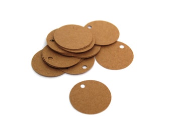 May include: A stack of brown round paper gift tags with a hole punched in the top.