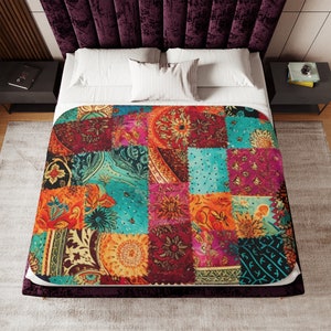 May include: A colorful patchwork quilt with a variety of floral and paisley patterns in shades of red, orange, yellow, green, blue, and purple. The quilt is made of different fabrics sewn together in a random pattern.