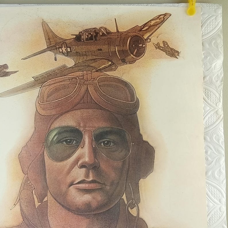 May include: A vintage illustration of a pilot wearing a brown leather aviator helmet and goggles. Above the pilot's head, a detailed drawing of a vintage airplane is depicted, with two additional planes in the background. The artwork has a sepia tone.