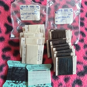 May include: Assortment of bead cord and nylon thread in various colors. Includes white, black, and light blue thread spools from Griffin, and bead cord from Eastern Findings Corp. The nylon thread spools are 6.5 ft.