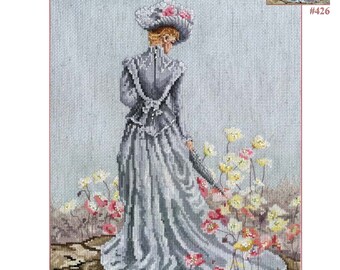 May include: Cross stitch pattern featuring a woman in a gray dress and a white hat walking through a field of flowers. The title of the pattern is "Elegance of Spring" by Marty Bell's. The pattern number is #426.