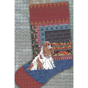 May include: Cross stitch pattern for a Christmas stocking featuring a cocker spaniel sitting in front of a fireplace. The pattern includes an alphabet for personalization.  ©Copyright 2023 Pegasus Originals Inc. 129 Minnie fallaw Rd, Lexington, SC 29073
