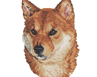May include: A cross-stitch kit featuring a Shiba Inu dog with brown fur and black eyes. The kit includes floss, fabric, needle, instructions, and a charted design. The kit is from Pegasus Originals Inc. and is labeled "Shiba Inu" and "Kit #K1427".