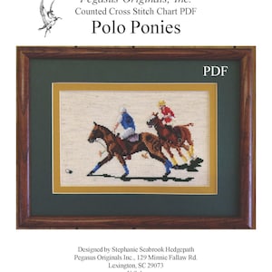 May include: A framed cross-stitch chart titled "Polo Ponies" by Pegasus Originals, Inc. The artwork depicts two polo players on horseback, rendered in detailed cross-stitch. The frame is dark wood with a green and gold matting.