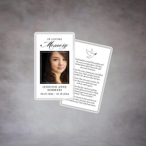 May include: A white and gray memorial card with a dove and olive branch. The card features a black and white photo of a young woman and the text "In Loving Memory Jennifer Anne Sommers 09.07.1992 - 07.16.2024".
