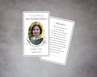 May include: A white memorial card with a floral design and a photo of a woman. The card includes the text "In Loving Memory of Jane Sterling Jackson" and the dates "October 17, 1938" and "April 29, 2024". The back of the card features a poem titled "Afterglow" about leaving a happy memory behind.