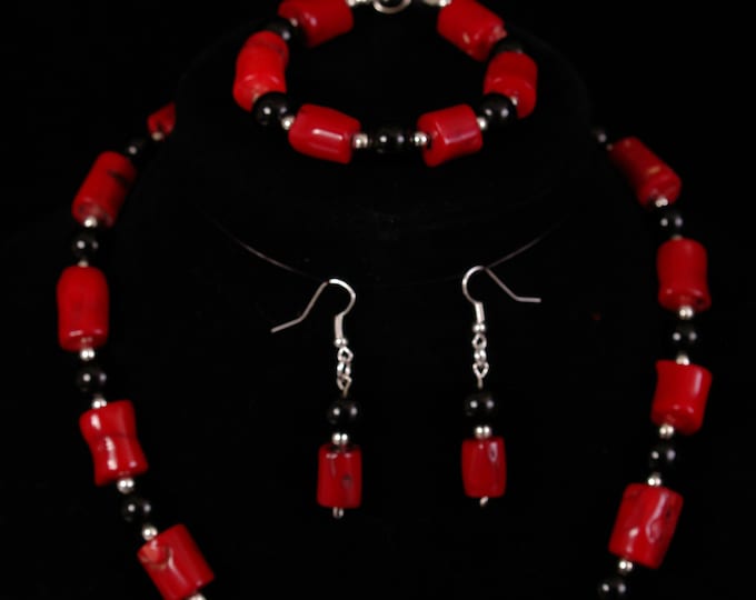 Bamboo coral and black onyx necklace, bracelet, and earrings.