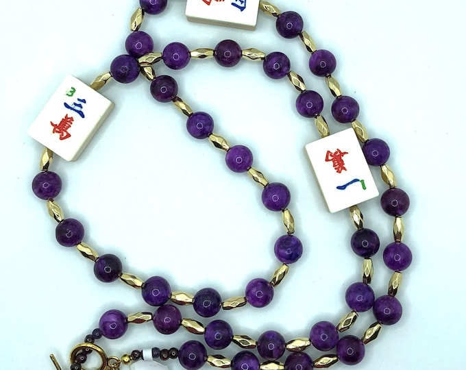 Mahjong necklace with purple sodalite and golden beads with crack tiles made of bamboo and bone.