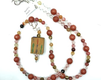 Peach aventurine and carnelian necklace with a wooden antique mahjong tile that is hand painted.