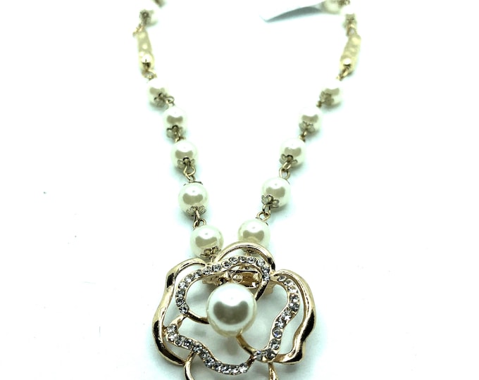 Crystal and silver necklace and bracelet; pearl necklace with detachable pen.