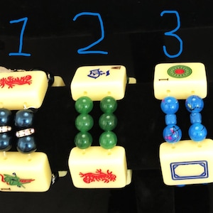 Yellow mahjong tiles with colored bead bracelet