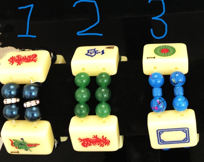 Yellow mahjong tiles with colored bead bracelet