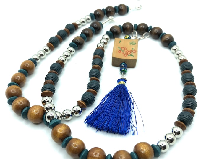Light weight necklace with wooden beads and a flower mahjong tile.