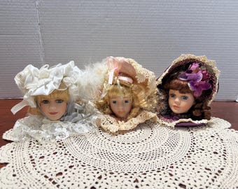 Fancy victorian porcelain Doll Head Ornaments