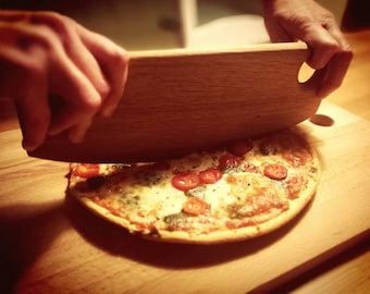 Hand carved hardwood pizza cutter