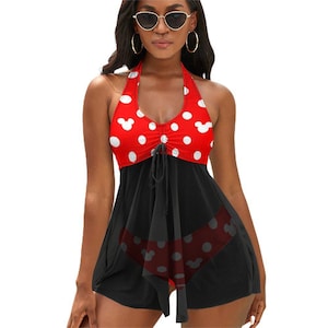 May include: Red and black swimsuit with white polka dots and a Mickey Mouse head pattern. The swimsuit has a halter top and a skirt.