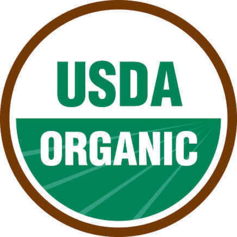 May include: A brown circle with a white background and green text. The text says "USDA Organic".