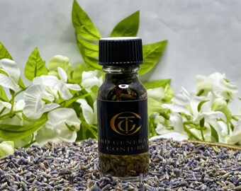 May include: A small clear glass bottle with a black ribbed screw cap containing dark liquid and dried herbs. A black label features a gold circular logo with the letters TC and the text THIRD GENERAL CONJURE printed in gold lettering.