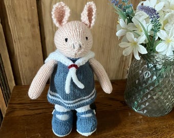 Hand Knitted Pink Pig in a Blue Sailor Dress