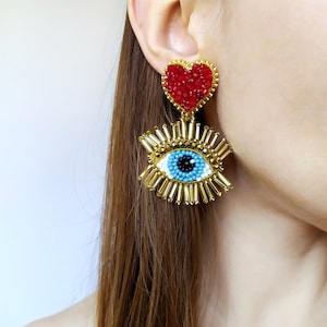 Evil eye earrings. Gold and red heart earrings.