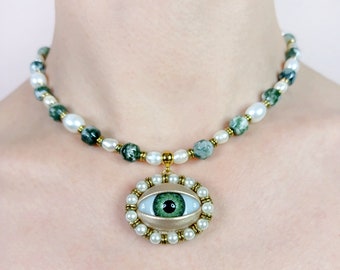 Collier de perles mauvais œil. Collier en agate, perle et hématite avec pendentif oeil vert.