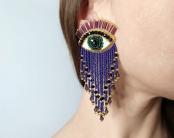 Evil eye beaded earrings. Purple and gold fringe earrings.